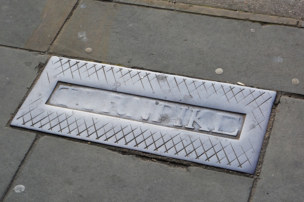an image of the Turnpike marker on the pavement outside Cammack's Furniture Store